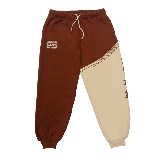 Rust-colored fabric with a white embroidered "G" logo featuring star details on the sweatpants.