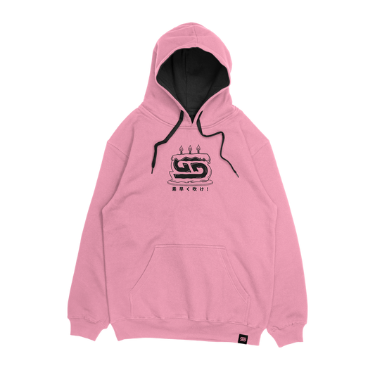 Pink hoodie with anime girl holding a birthday cake and "Happy Birthday" text in black and white on the back.