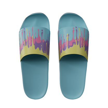 Light blue slides with yellow straps featuring pink and purple paint drip patterns across the top band.