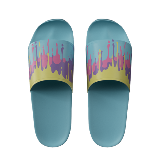 Light blue slides with yellow straps featuring pink and purple paint drip patterns across the top band.