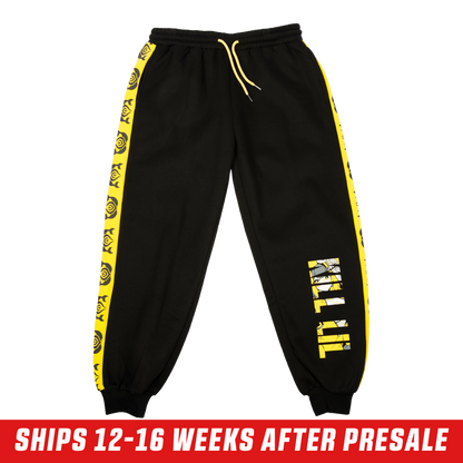 Black sweatpants with bold yellow "KILL LIL" text featuring an anime character graphic inside the letters.