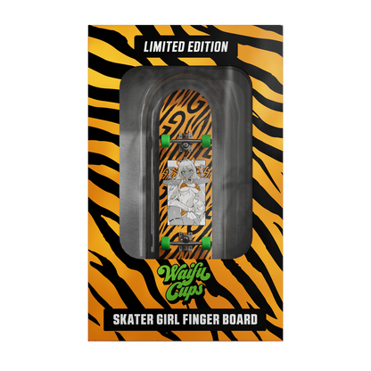 Miniature skateboard with black grip tape and bright green wheels on a natural wood deck edge.