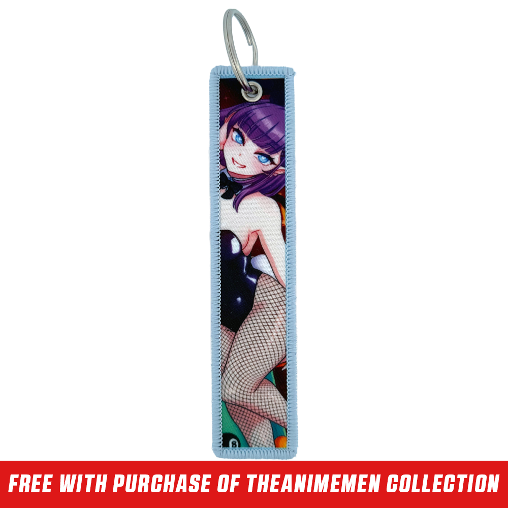 Keychain tag with anime-style purple-haired character, blue eye, and pink heart playing card design on light blue border.
