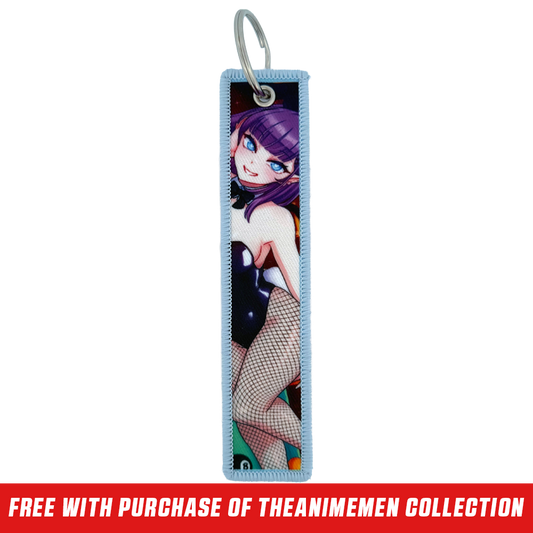 Keychain tag with anime-style purple-haired character, blue eye, and pink heart playing card design on light blue border.