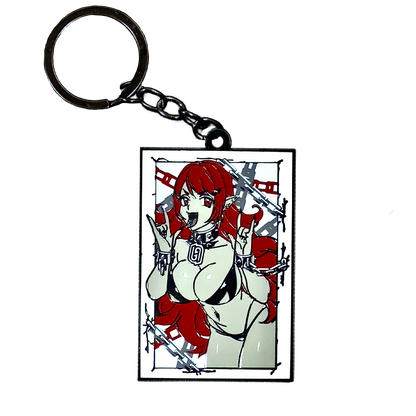Glow-in-the-dark keychain featuring a silhouetted vampiress with flowing hair and abstract shapes in bright green.